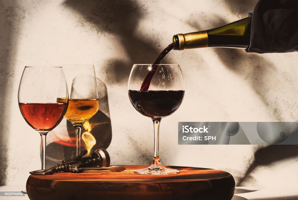 Pouring a glass of red wine